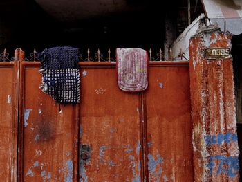 Low angle view of clothes drying against wall