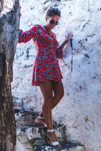 Full length of woman standing on rock