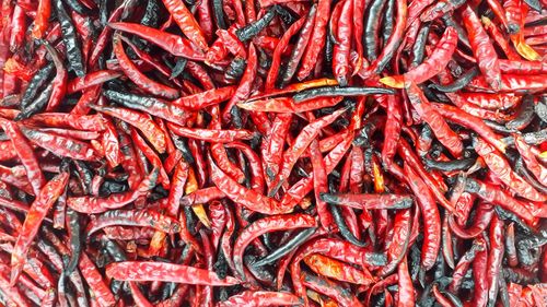 Full frame shot of red chili peppers for sale at market