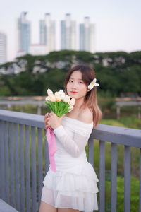 Young woman holding bouquet