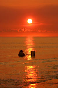 Scenic view of sea at sunset