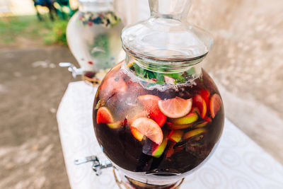 High angle view of fruits in glass jar on table