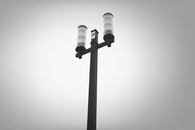 Low angle view of street light against sky