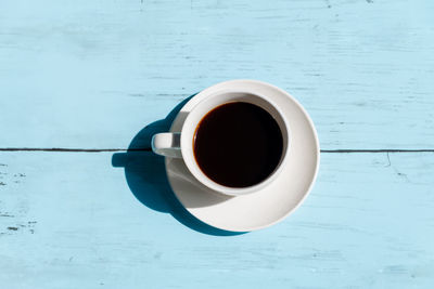 Directly above shot of coffee cup on table