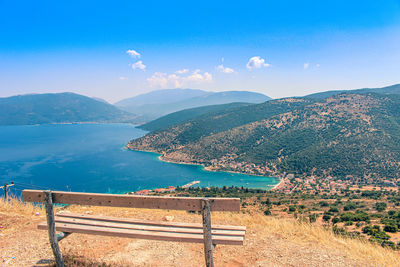 Scenic view of mountains against blue sky