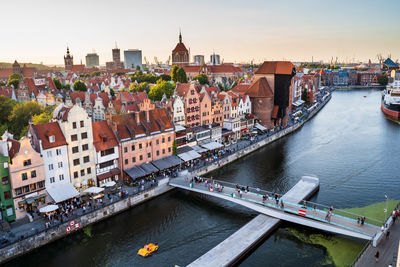 High angle view of river amidst buildings in city