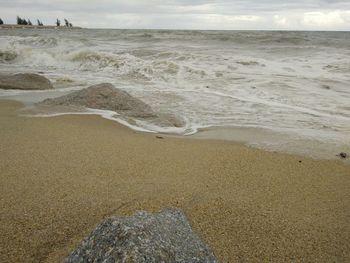 Scenic view of beach against sky