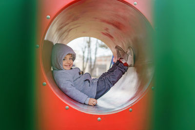 Portrait of smiling boy playing in playground