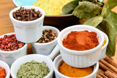 High angle view of spices in bowls on table