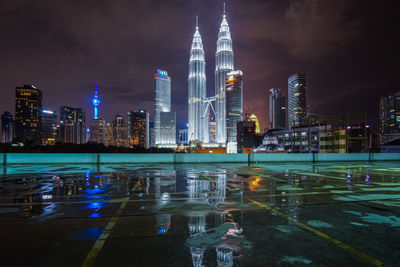 Illuminated buildings in city at night