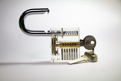 Close-up of telephone booth on table against white background