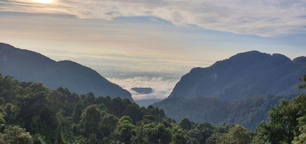 Panoramic view of mountains against sky during sunset