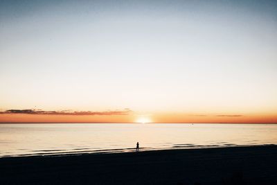 Scenic view of sea at sunset