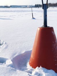 Close-up of ice on beach against sky