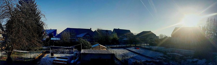 View of buildings against clear blue sky