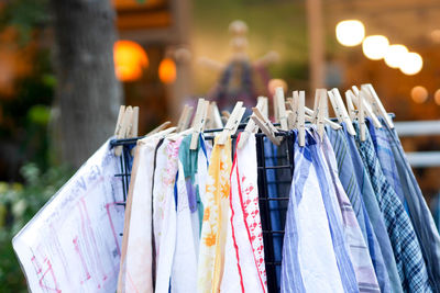 Close-up of clothes hanging on rack