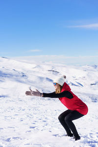 Full length of man skiing on snow covered landscape