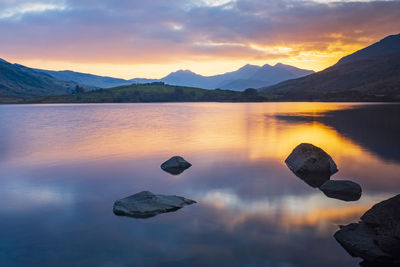 Reflections on llyn mymbyr in capel curig, north wales, uk