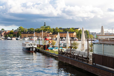 Boats moored at harbor