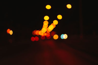 Defocused image of illuminated lights at night