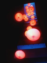 Low angle view of lit light bulb