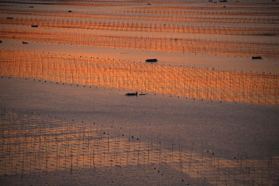 High angle view of silhouette boats in river