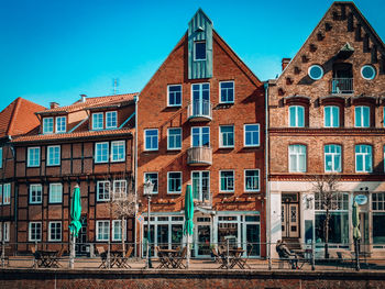 Low angle view of buildings against blue sky