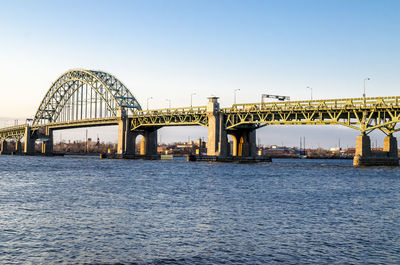 Bridge over river against clear sky