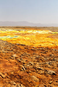 Scenic view of land against clear sky