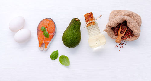 High angle view of vegetables on table against white background