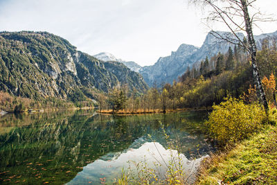 Scenic view of lake and mountains against sky