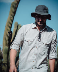 Full length of man wearing hat standing outdoors