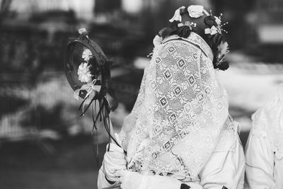 Ancient carnival of sauris. traditional wooden masks. black and white. italy