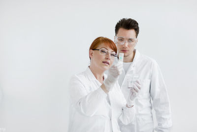 Two scientists working in laboratory