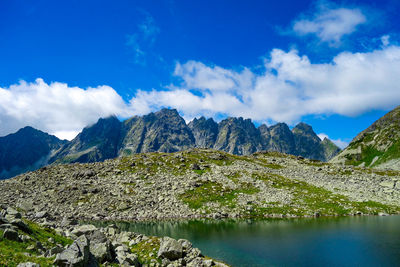 Scenic view of lake and mountains against sky