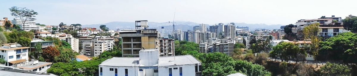 Buildings in city against sky