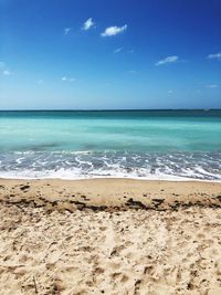 Scenic view of sea against blue sky