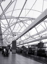 Low angle view of people at railroad station