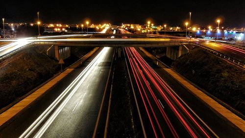 High angle view of light trails on road at night