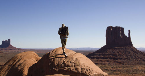 Rock formations on landscape against clear sky