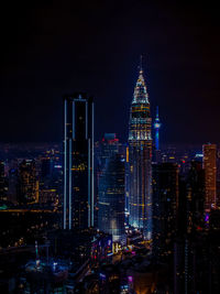 Illuminated buildings in city at night