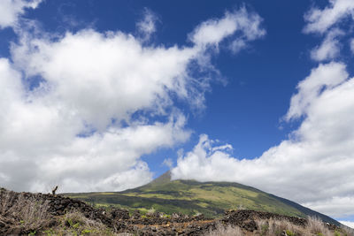 Low angle view of land against sky