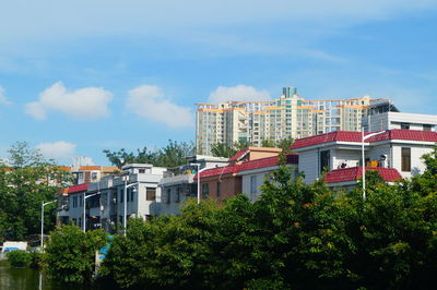 Low angle view of buildings against blue sky