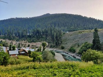 Scenic view of landscape and mountains against sky