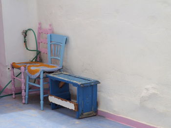 Chair and table against wall