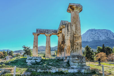 Old temple against clear blue sky