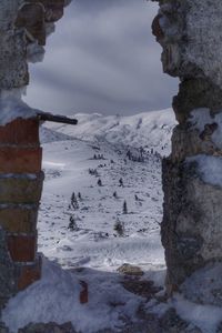 Scenic view of frozen lake against sky during winter