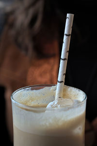 Close up of an ice coffee with straw