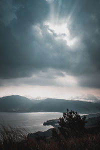 Scenic view of sea against cloudy sky