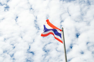 Low angle view of thai flag against sky